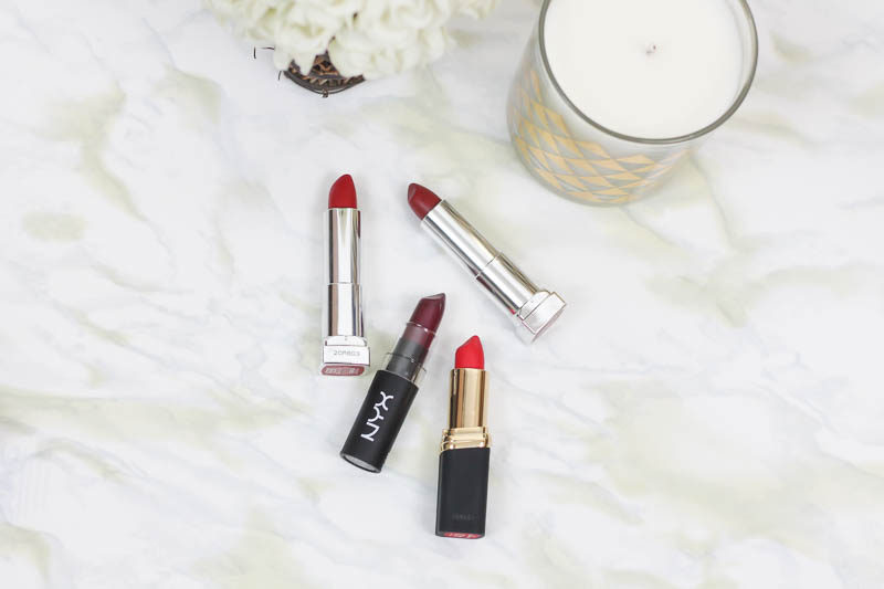 Miami beauty blogger Stephanie Pernas of A Sparkle Factor reviews 4 of the best red lipsticks from the drugstore