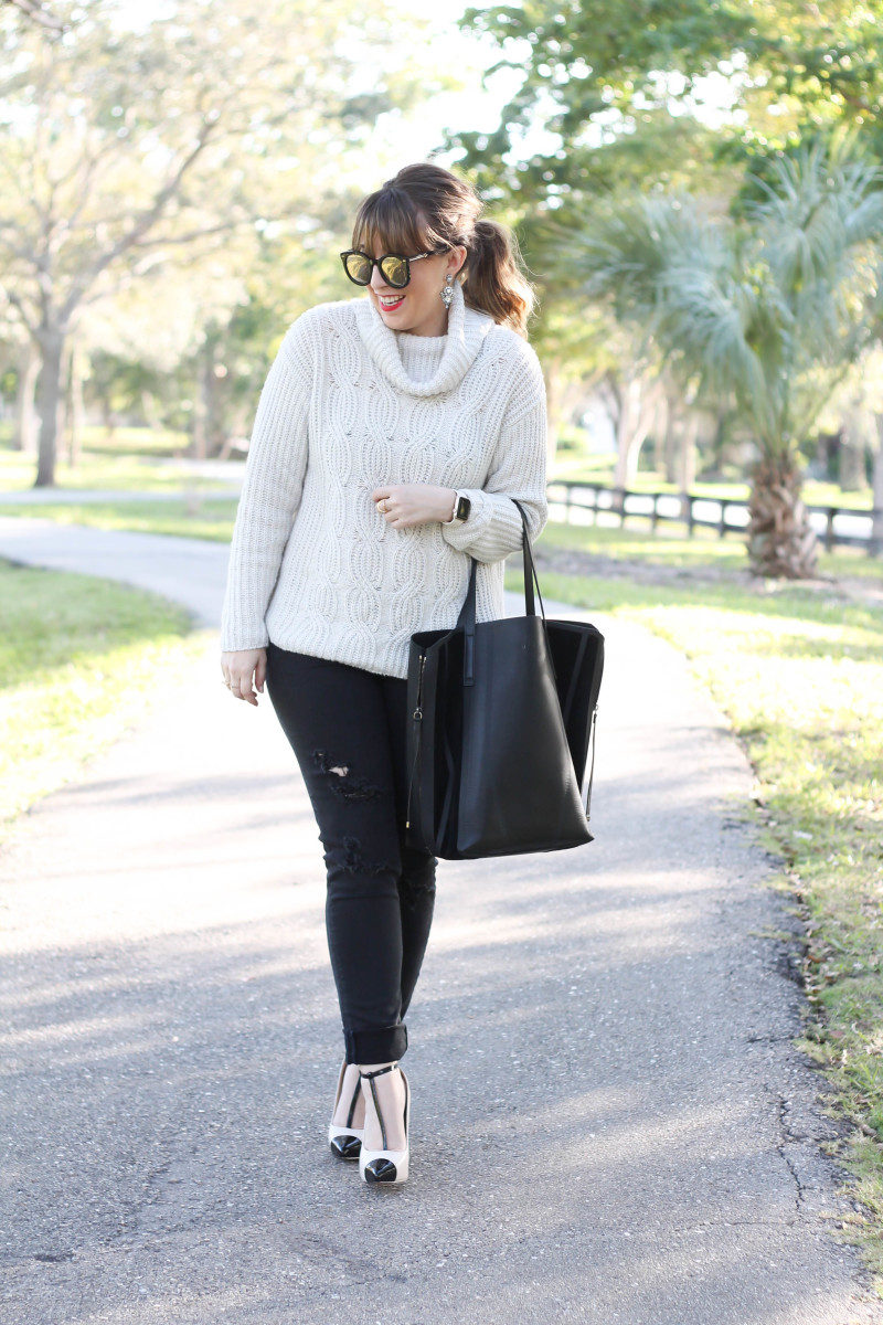 Turtleneck sweater, distressed black jeans, cap toe pumps