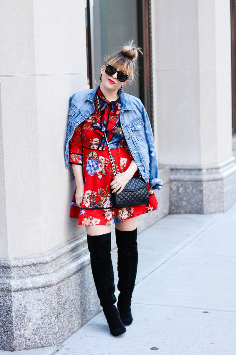 Miami fashion blogger Stephanie Pernas of A Sparkle Factor wearing a J. Crew Factory draped jean jacket over a Shopbop floral print dress with Sole Society Leandra boots for a chic fall look