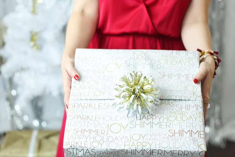 Miami fashion blogger Stephanie Pernas holding a pretty holiday gift