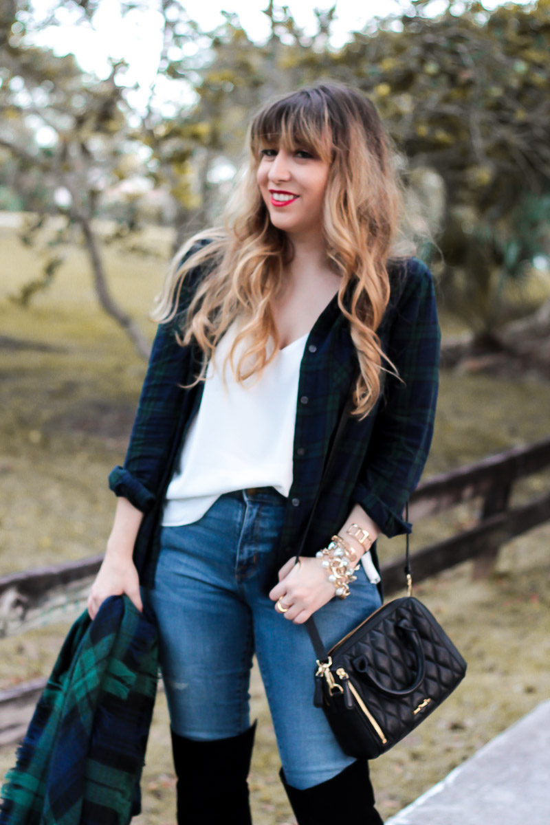 Miami fashion blogger Stephanie Pernas layers a plaid button down over a camisole and jeans for an easy fall outfit idea 