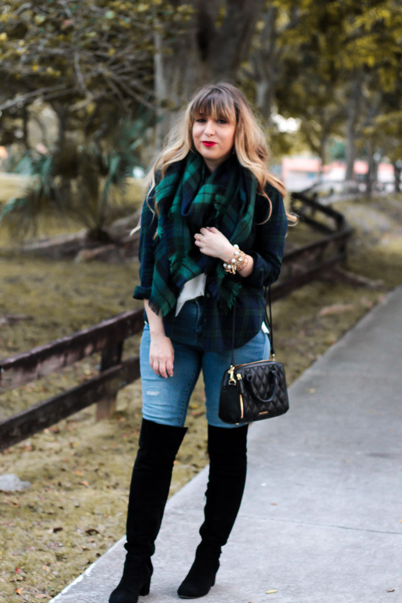 Miami fashion blogger Stephanie Pernas styles a casual holiday plaid outfit idea around the Sole Society Leandra over the knee boots and a cozy plaid blanket scarf with jeans 