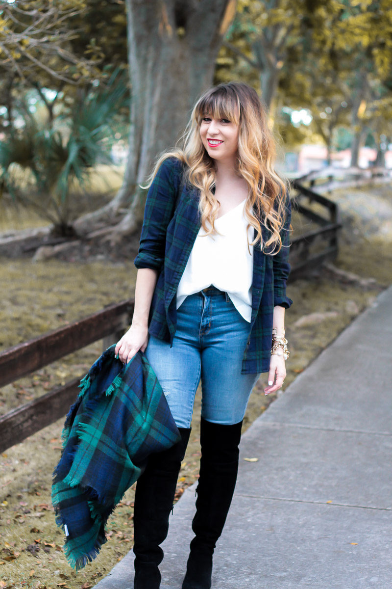 Fashion Blogger Stephanie Pernas wears black over the knee boots with jeans and a cozy blanket scarf 