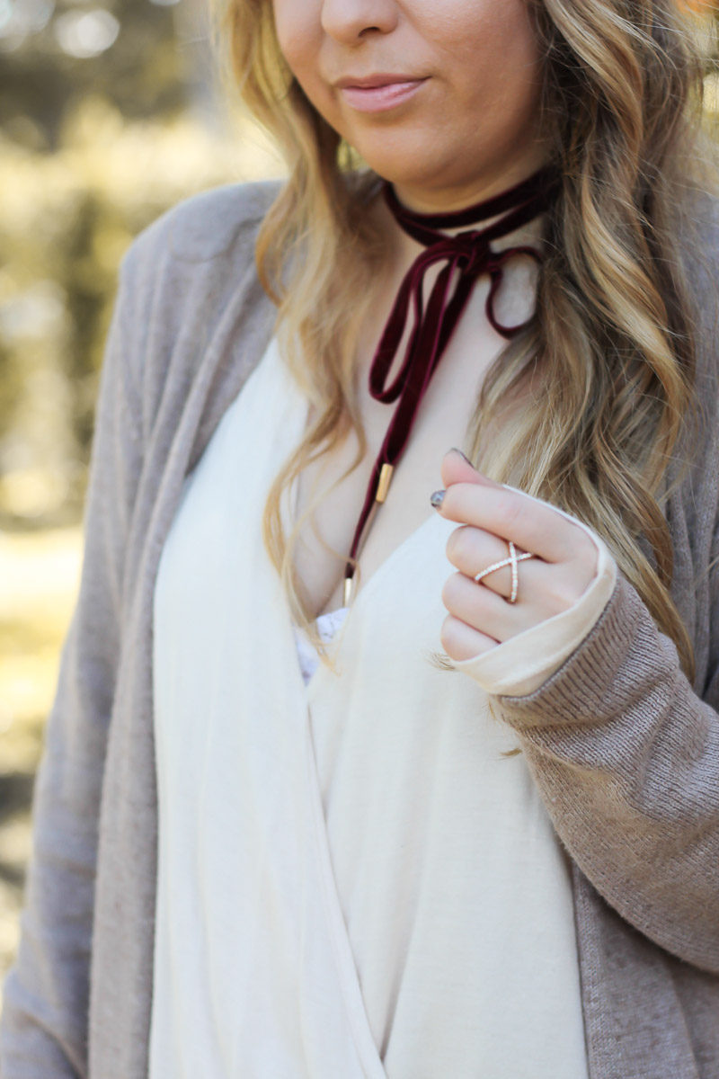 Miami fashion blogger Stephanie Pernas styles a burgundy velvet choker with a cozy cardigan 