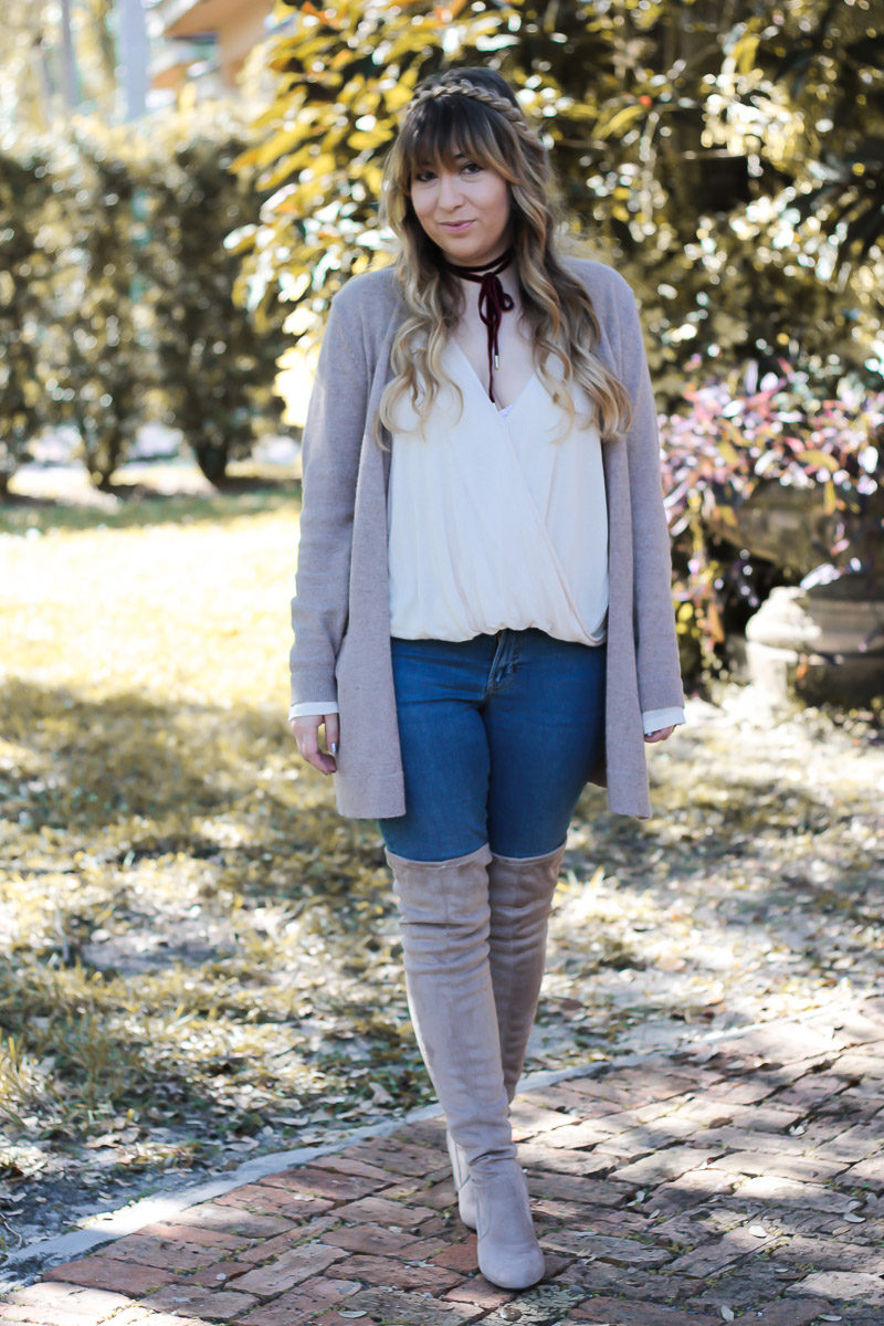 Miami fashion blogger Stephanie Pernas styles a cozy Thanksgiving outfit idea with an oversized Old Navy cardigan and Chinese Laundry over the knee boots. 