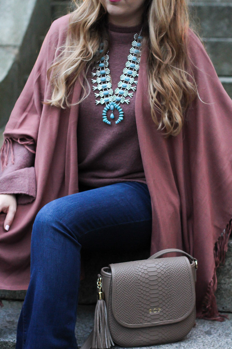 Miami fashion blogger Stephanie Pernas of A Sparkle Factor wearing a fringe shawl and bell sleeve sweater for a boho fall outfit idea 