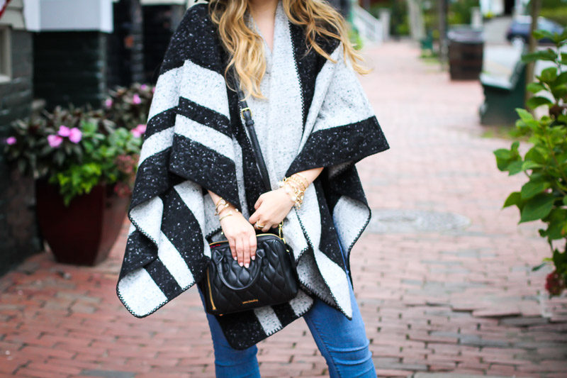 Miami fashion blogger Stephanie Pernas of A Sparkle Factor styles an ILY Couture stripe cape for an easy fall look in Nantucket