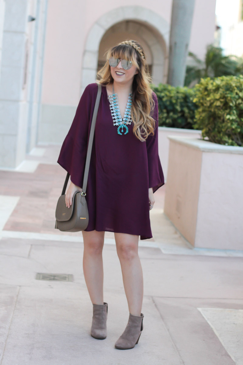 Plum dress and crown braid hairstyle