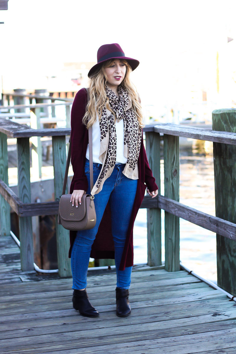 Miami fashion blogger shares fall outfit inspiration by styling a long cardigan with a fedora and leopard scarf