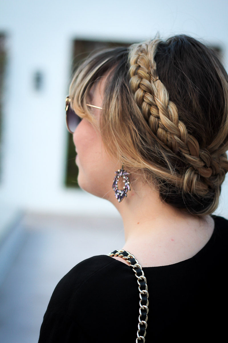 Miami fashion blogger Stephanie Pernas shares a pretty fall beauty look featuring a braided updo and statement earrings