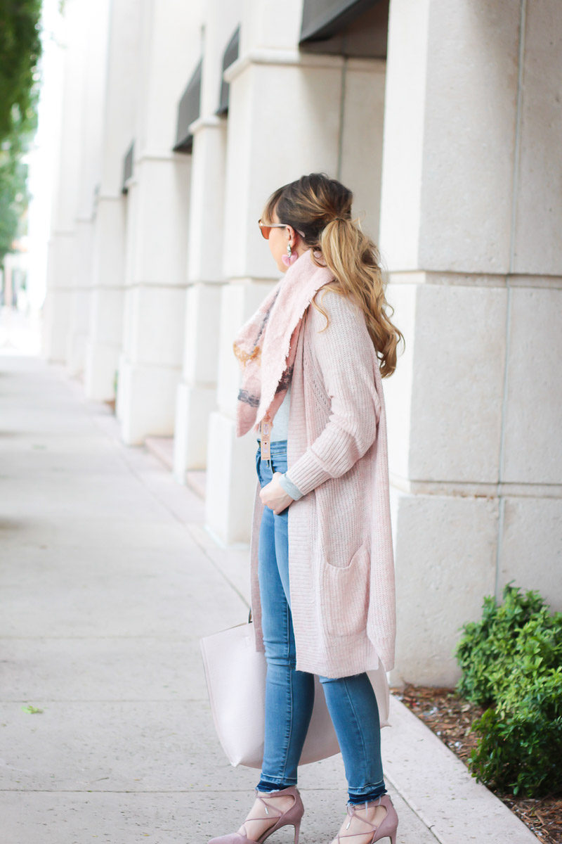 Miami fashion blogger Stephanie Pernas of A Sparkle Factor wearing a long pink cardigan and pink blanket scarf outfit 