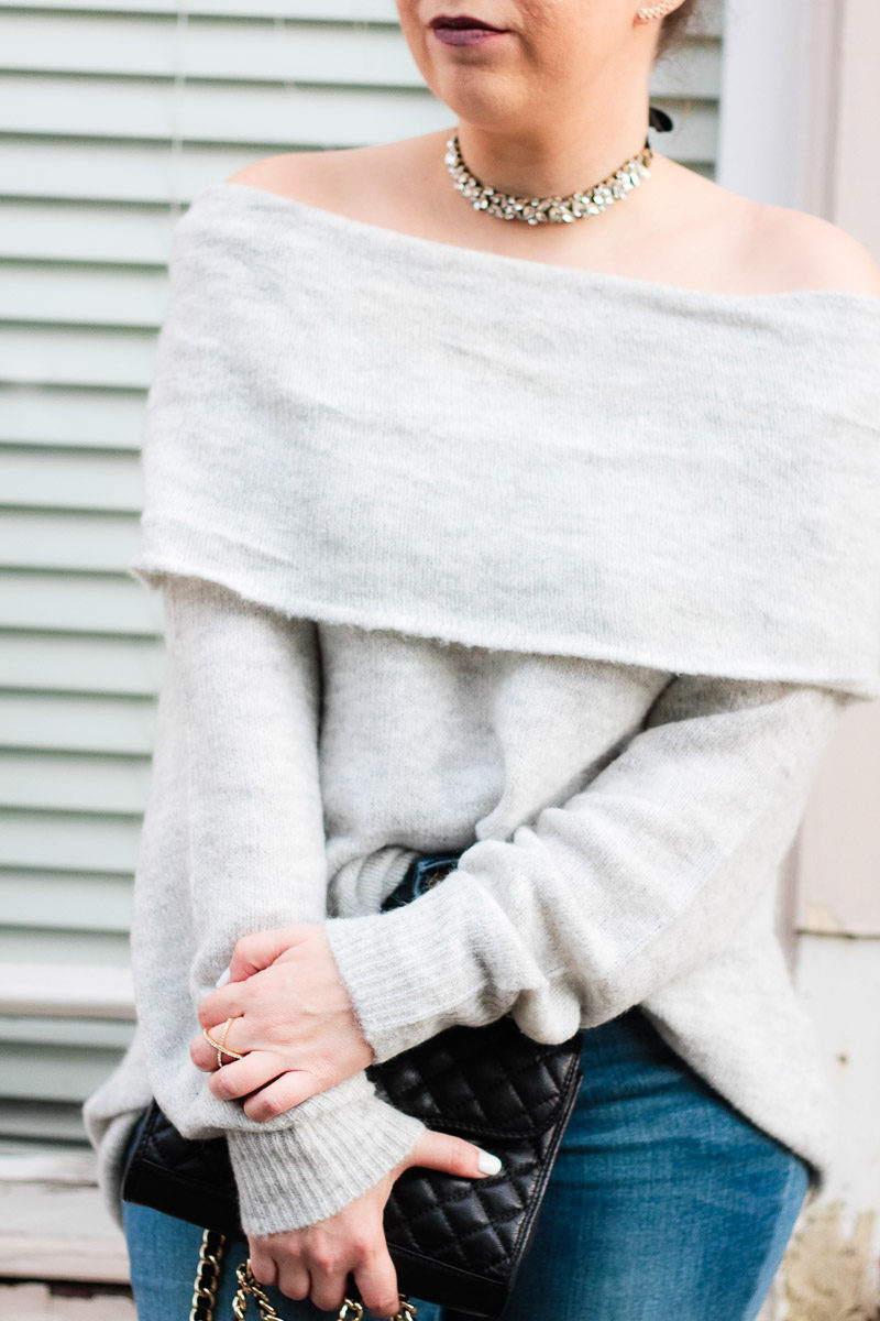 Miami fashion blogger Stephanie Pernas styles a cozy off the shoulder sweater with jeans and a choker 