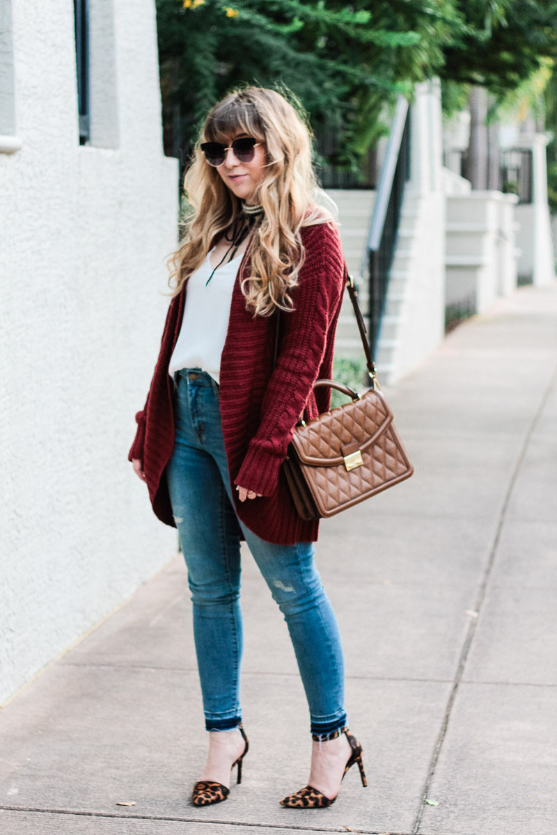 Miami fashion blogger Stephanie Pernas styles the Vera Bradley Lydia Satchel with jeans and a cardigan for a casual outfit idea