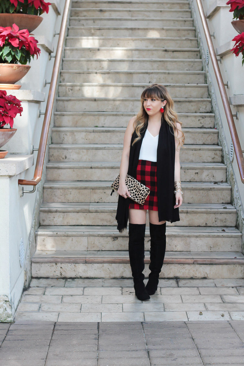 Miami fashion blogger Stephanie Pernas styling Sole Society over the knee boots with a holiday plaid skirt