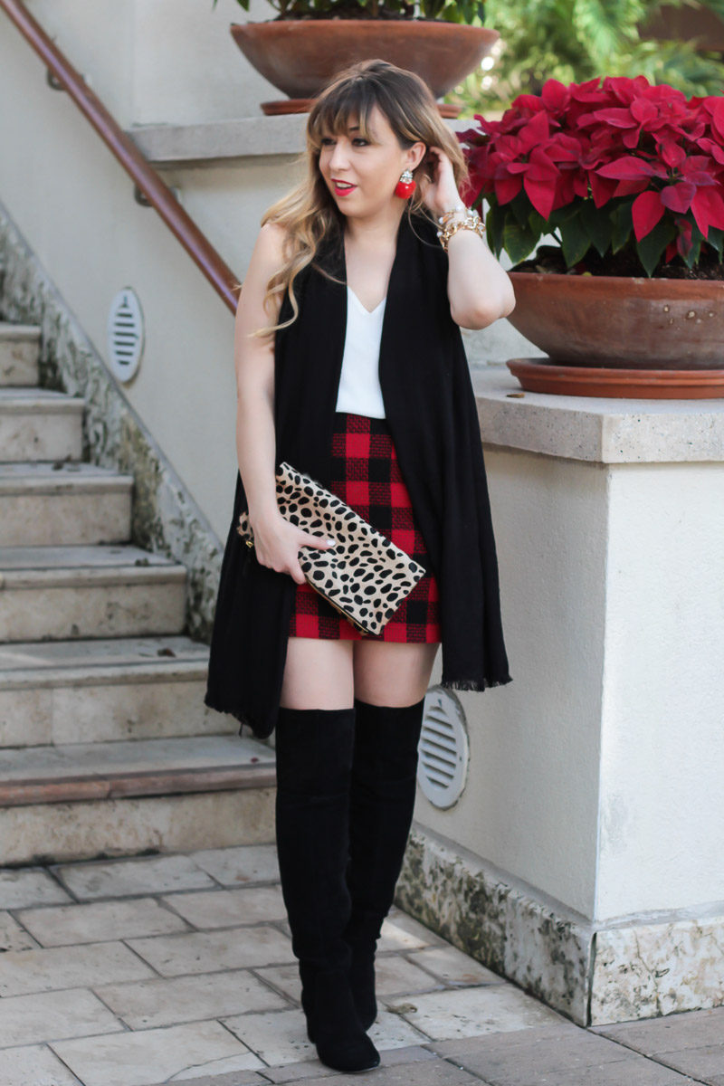 Fashion blogger wearing Sole Society Leandra boots and a plaid skirt outfit idea