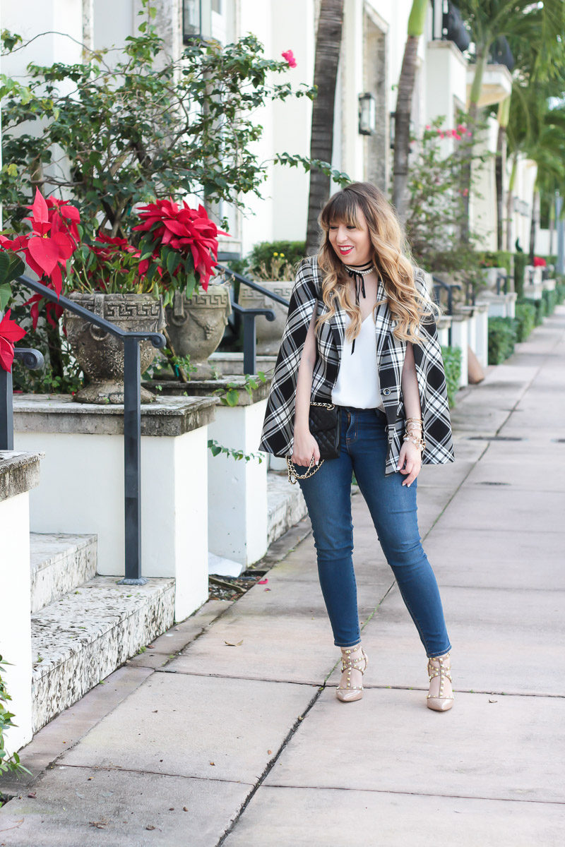 Miami fashion blogger Stephanie Pernas wearing a Trina Turk plaid cape blazer, jeans, and Sole Society Tiia pumps for a classic outfit idea 