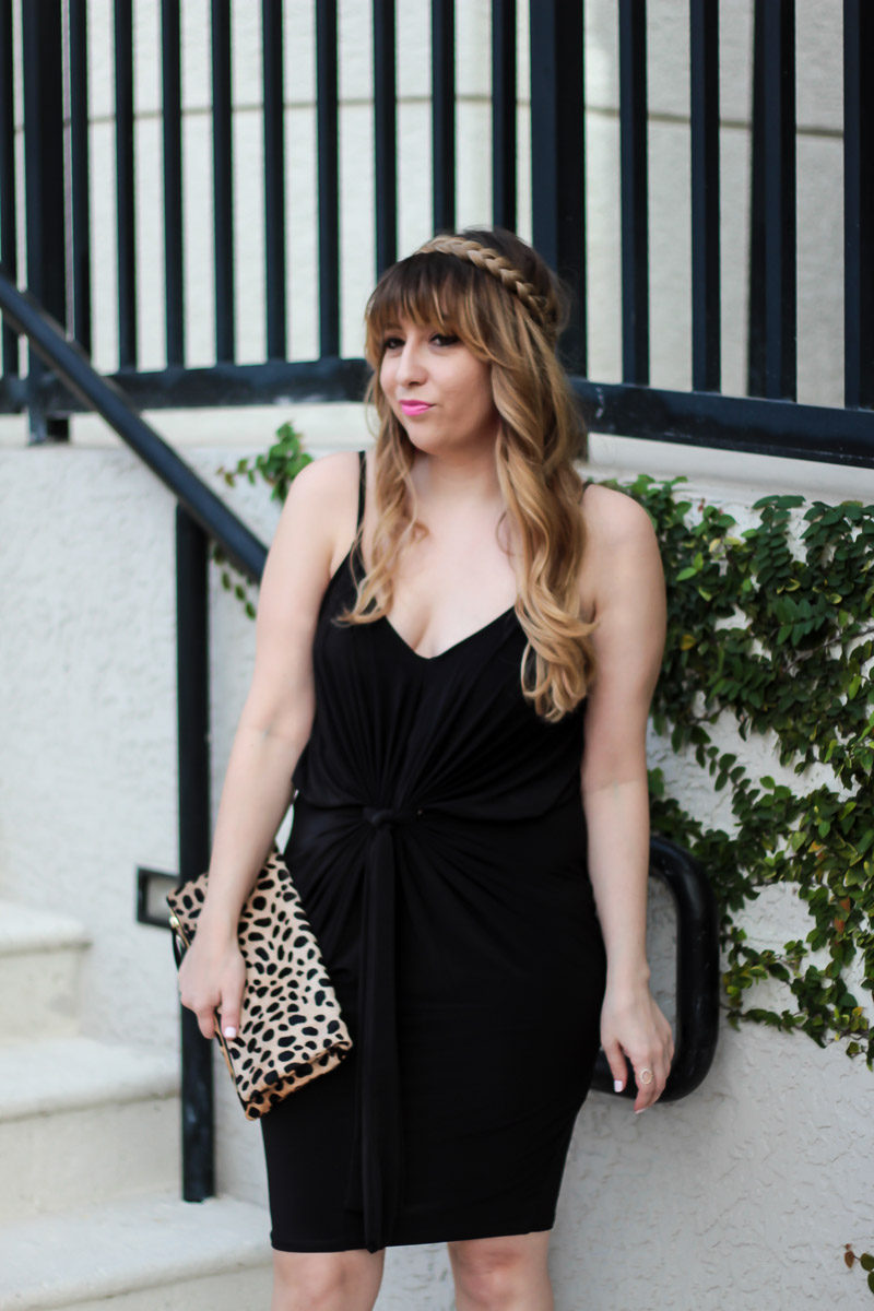 Miami fashion blogger Stephanie Pernas styles a black dress with leopard clutch