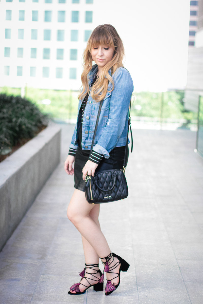 Miami fashion blogger Stephanie Pernas wearing a lace up body suit with leather skirt for a chic outfit idea 