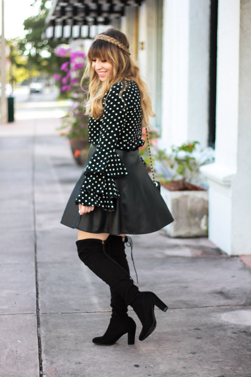 Fashion blogger Stephanie Pernas wearing over the knee boots and a leather skirt