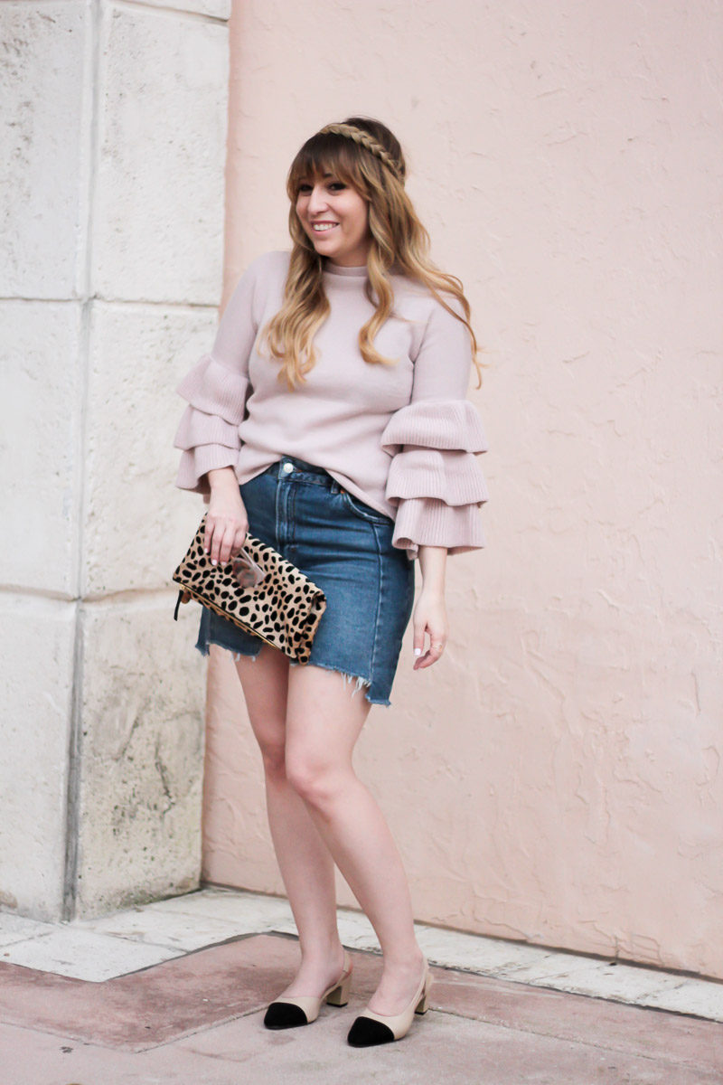 Miami fashion blogger Stephanie Pernas of A Sparkle Factor wearing a ruffle sweater, jean skirt and cap toe slingbacks. 