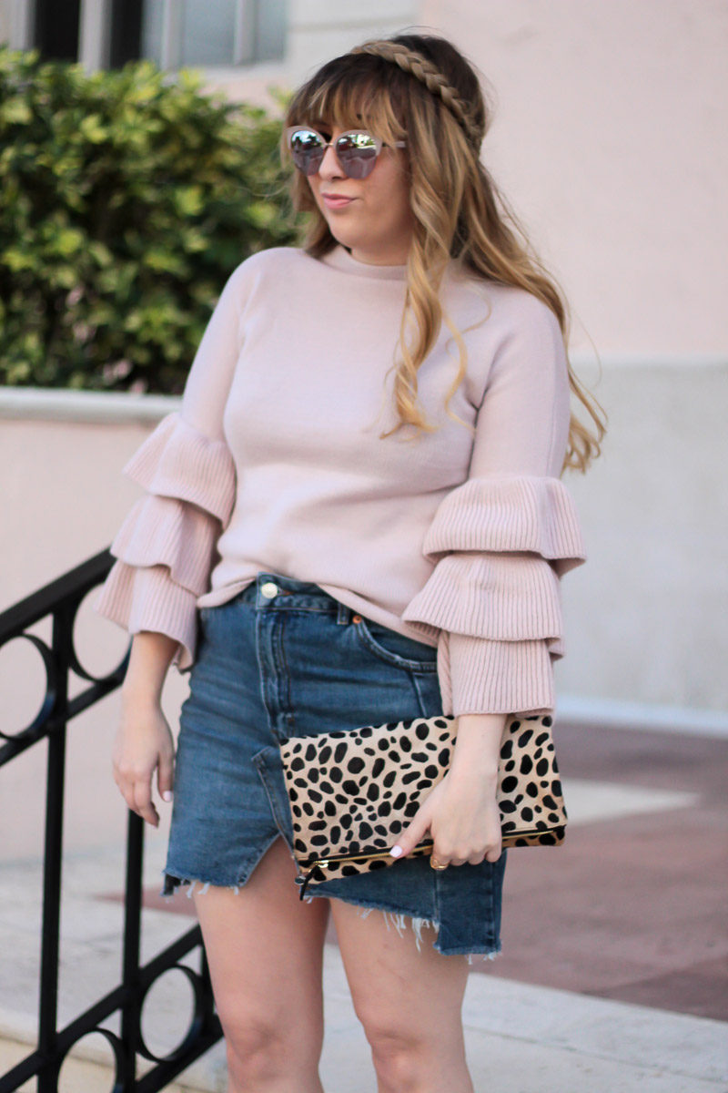 Miami fashion blogger Stephanie Pernas styles a blush ruffle sleeve sweater with a denim skirt