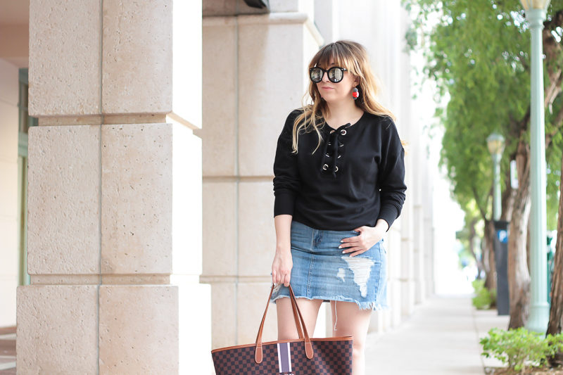 Miami fashion blogger Stephanie Pernas wearing a lace up sweater outfit for spring