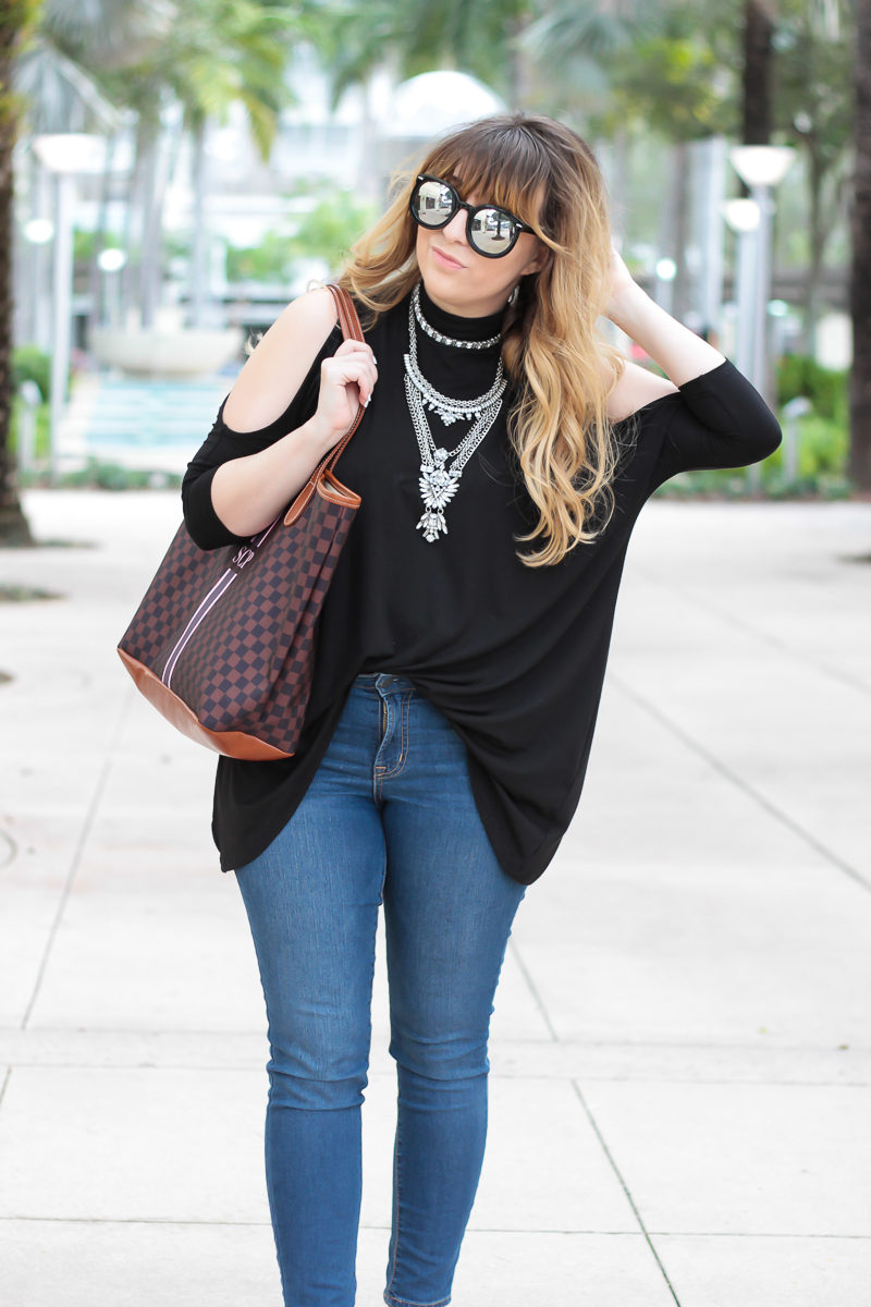 Miami fashion blogger Stephanie Pernas of A Sparkle Factor wearing a cold shoulder top with Baublebar Supernova statement necklace