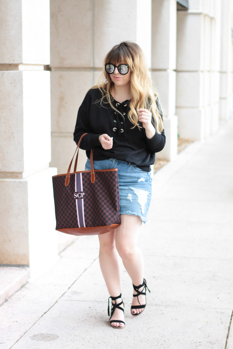 Miami fashion blogger Stephanie Pernas wearing a lace up sweater outfit idea