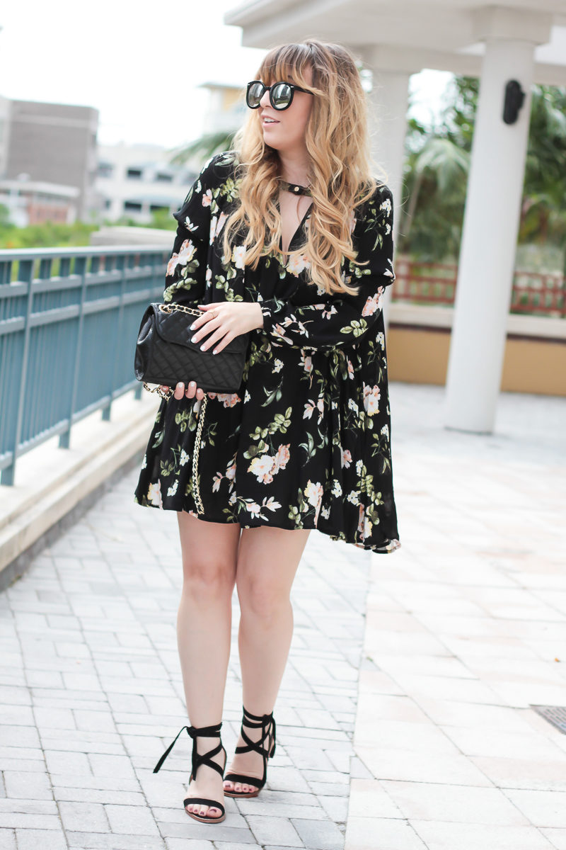  Miami fashion blogger Stephanie Pernas of A Sparkle Factor styles Chinese Laundry lace up heels with a Rebecca Minkoff Quilted Mini affair bag and a floral dress