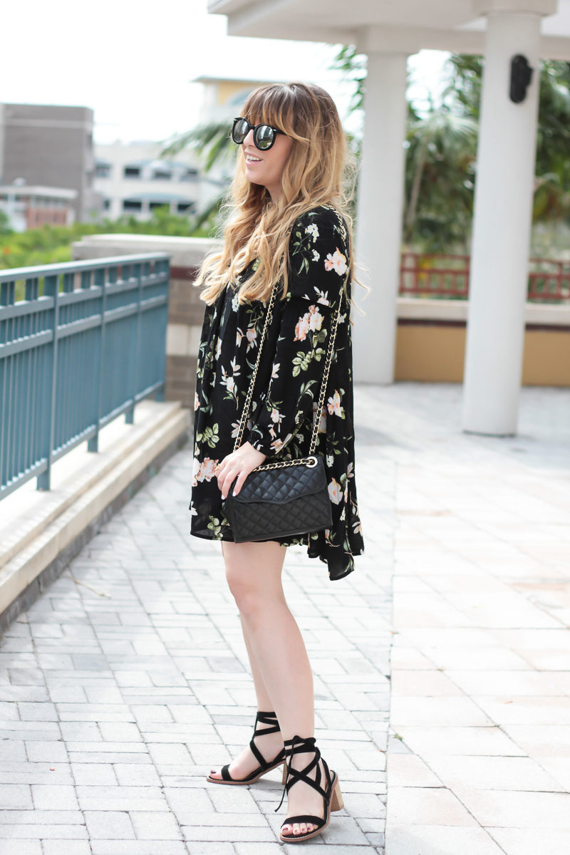  Miami fashion blogger Stephanie Pernas of A Sparkle Factor styles a spring dress outfit featuring a Shein floral lantern sleeve shift dress