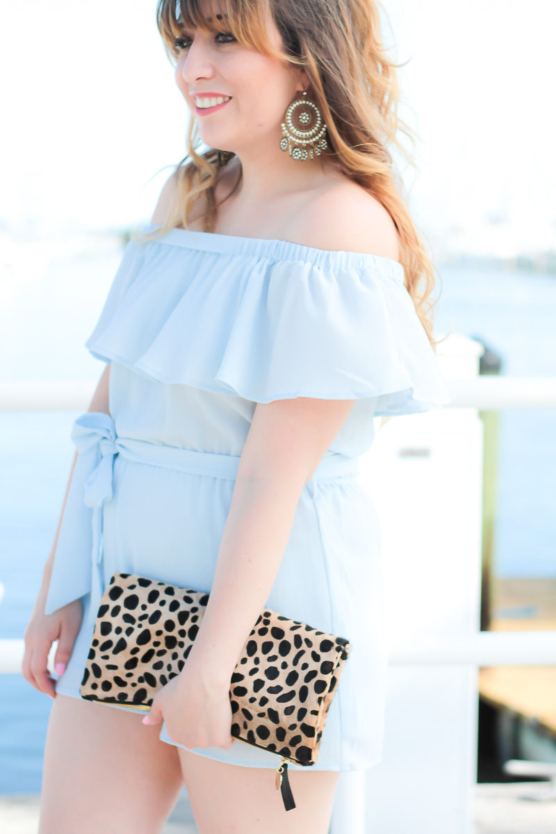 Miami fashion blogger Stephanie Pernas wearing an off the shoulder romper and leopard clutch