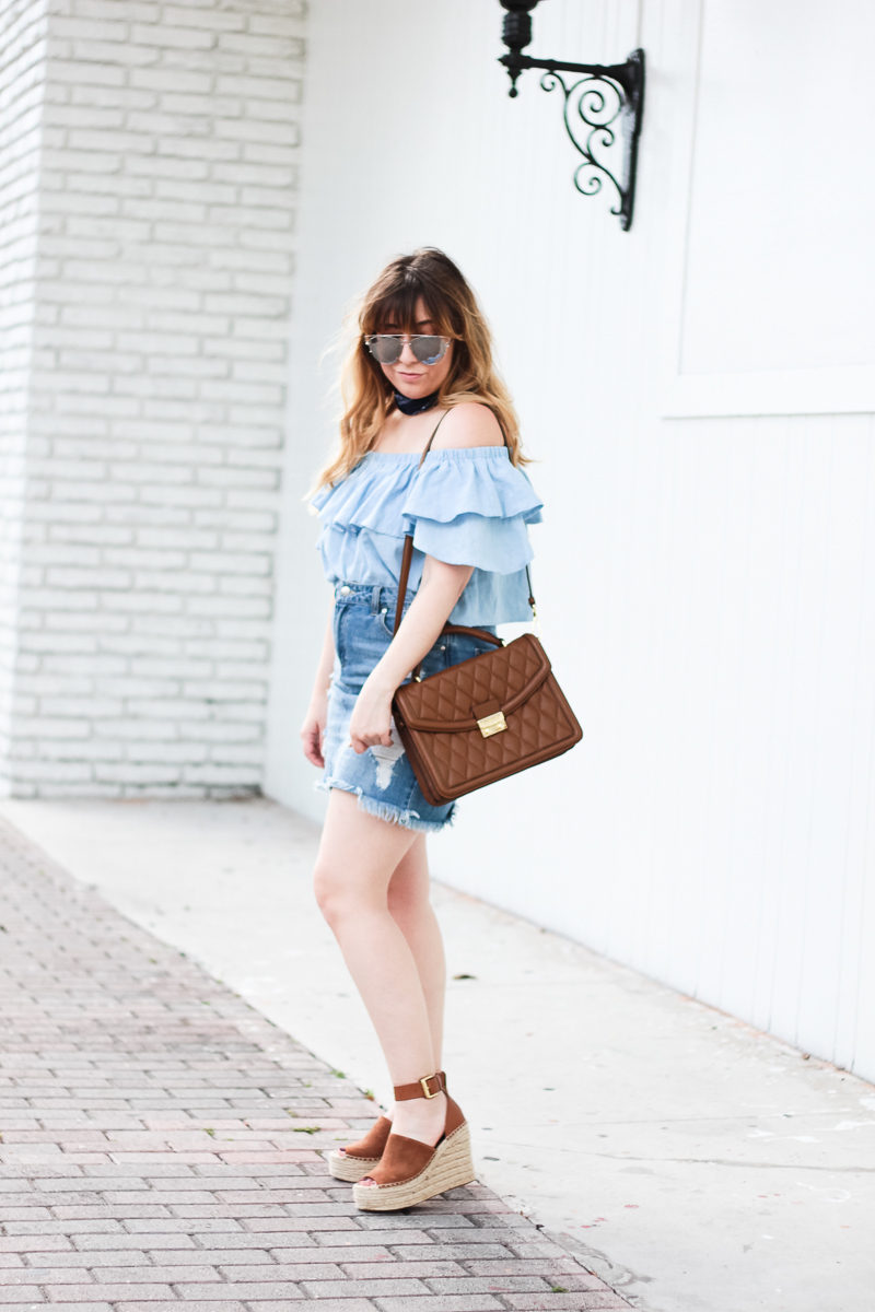 Miami fashion blogger Stephanie Pernas wearing a distressed jean skirt and off the shoulder top