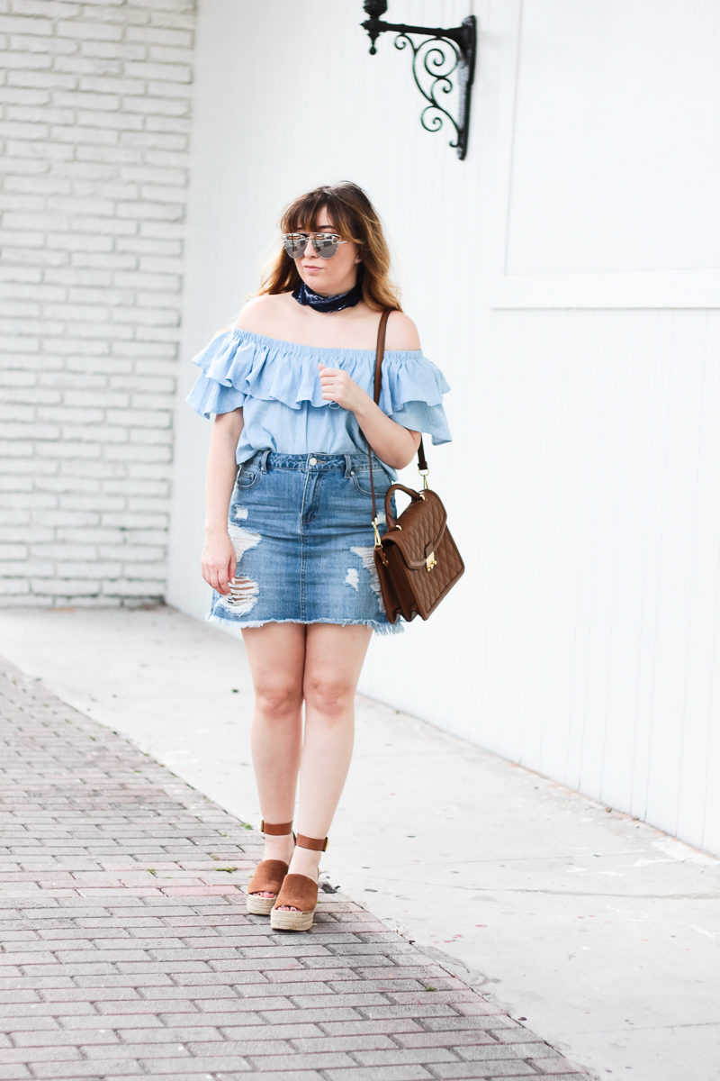 Miami fashion blogger Stephanie Pernas wearing a chambray off the shoulder top with a jean skirt for a casual spring outfit idea 