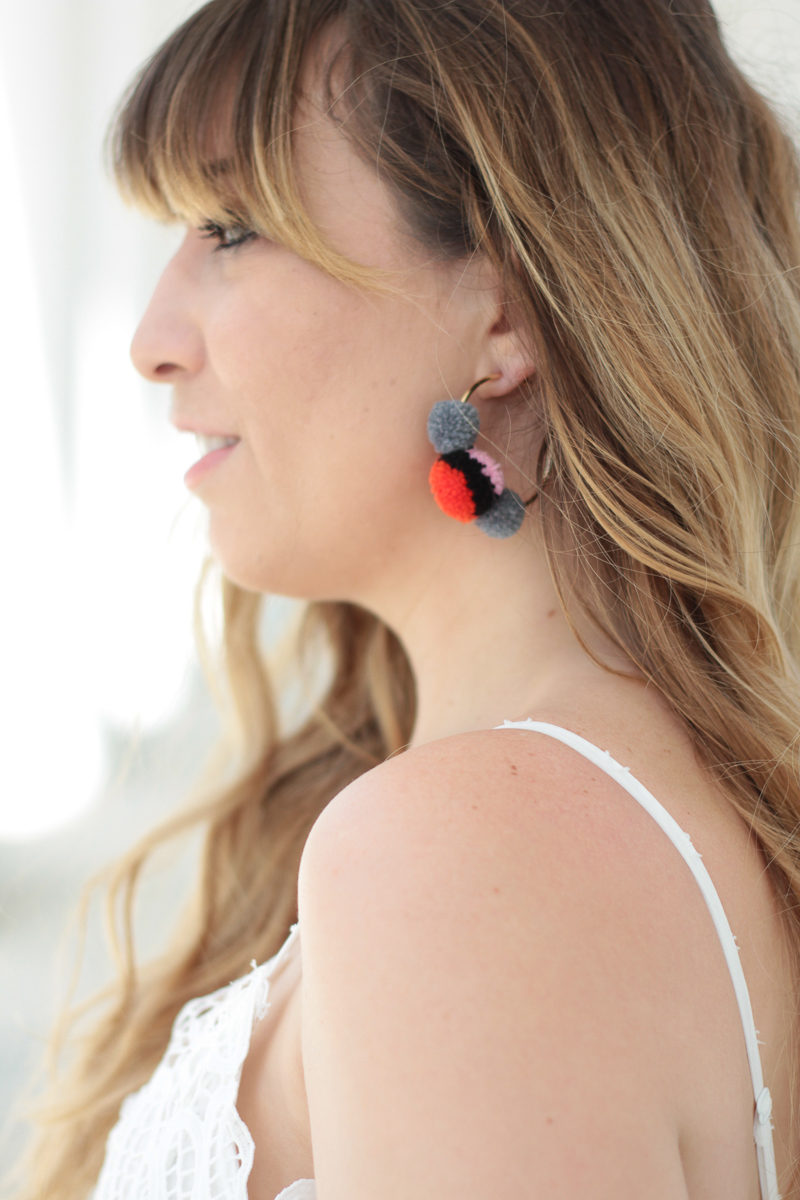 Miami fashion blogger Stephanie Pernas wearing Baublebar pompom earrings