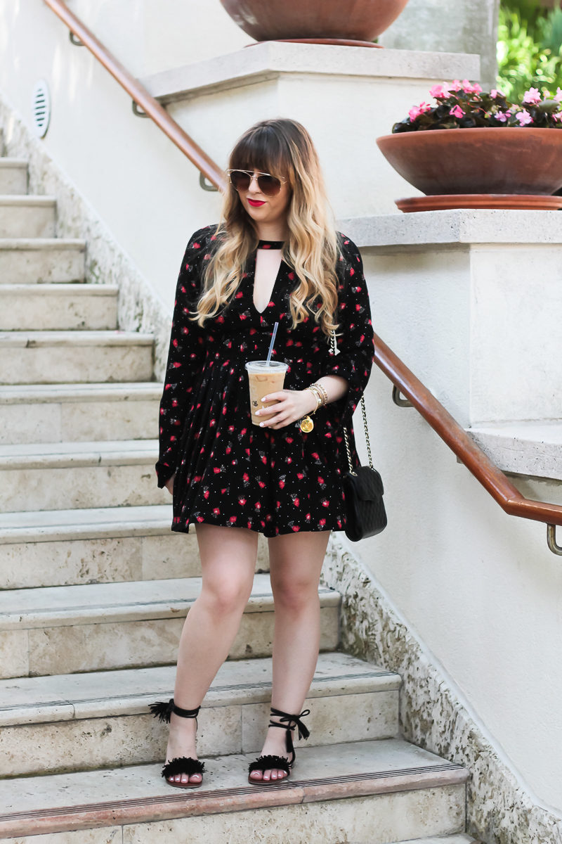 Miami fashion blogger Stephanie Pernas wearing a boho floral dress and fringe sandals