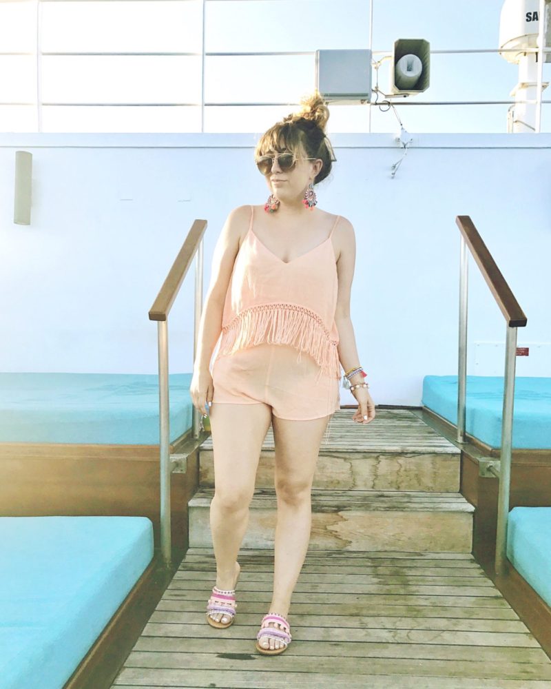 Miami fashion blogger Stephanie Pernas wearing a coral fringe romper