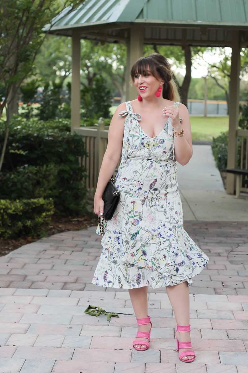 Miami fashion blogger Stephanie Pernas wearing hot pink sandals and a floral midi dress 