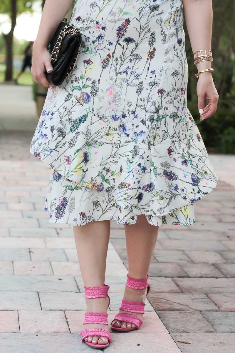 Miami fashion blogger Stephanie Pernas styles a floral midi dress with pink sandals 