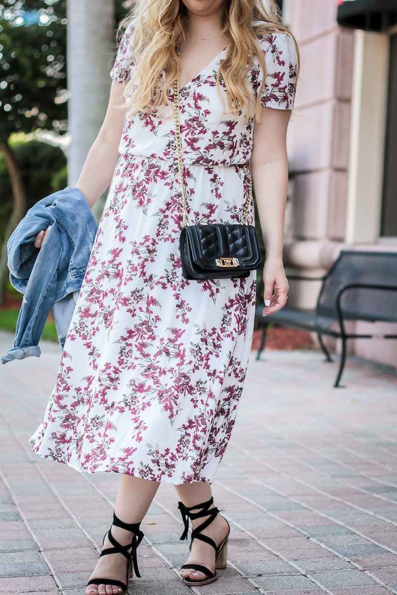 Miami fashion blogger Stephanie Pernas styling a Wayf floral midi dress 