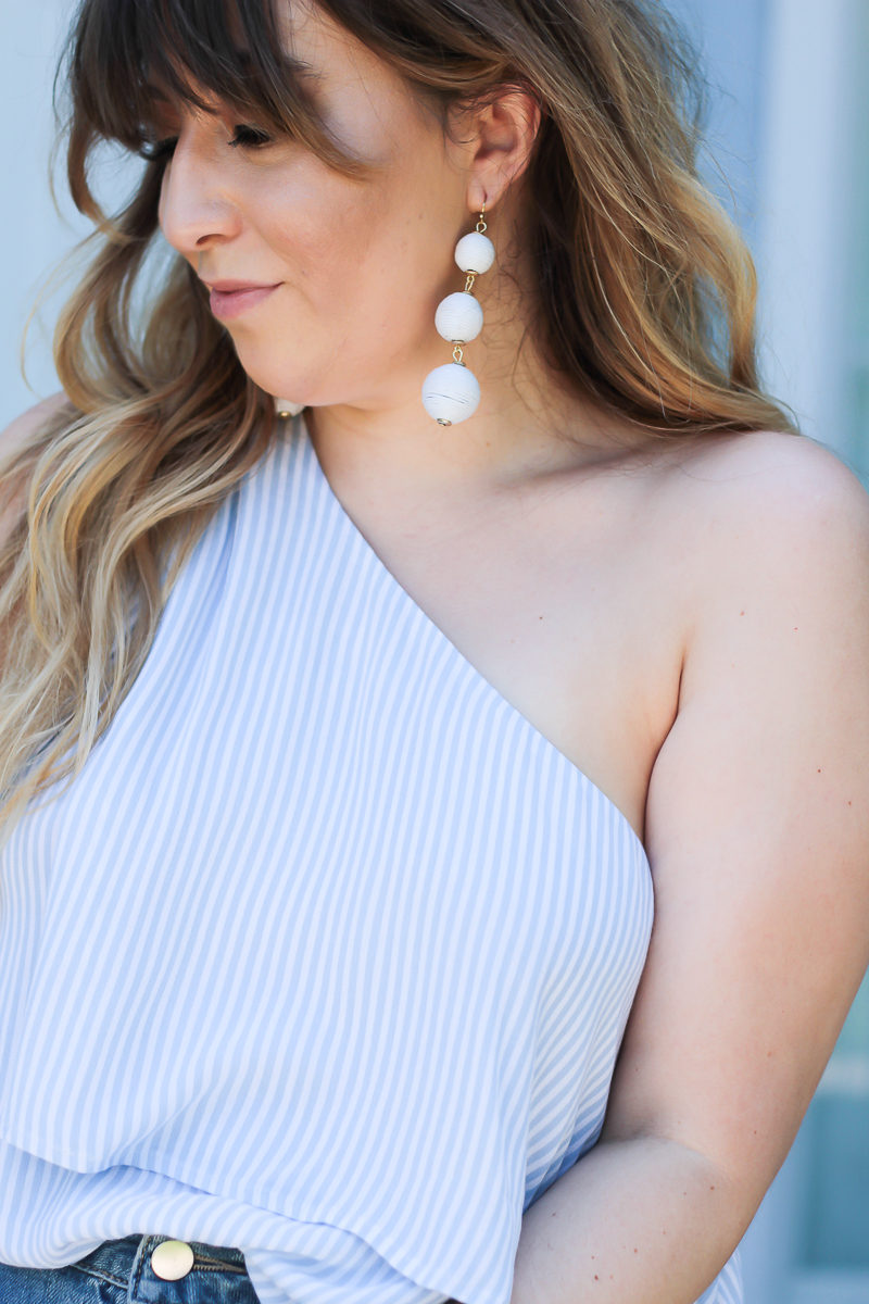 Miami fashion blogger Stephanie Pernas wearing Charming Charlie Austin earrings and a BP one shoulder top