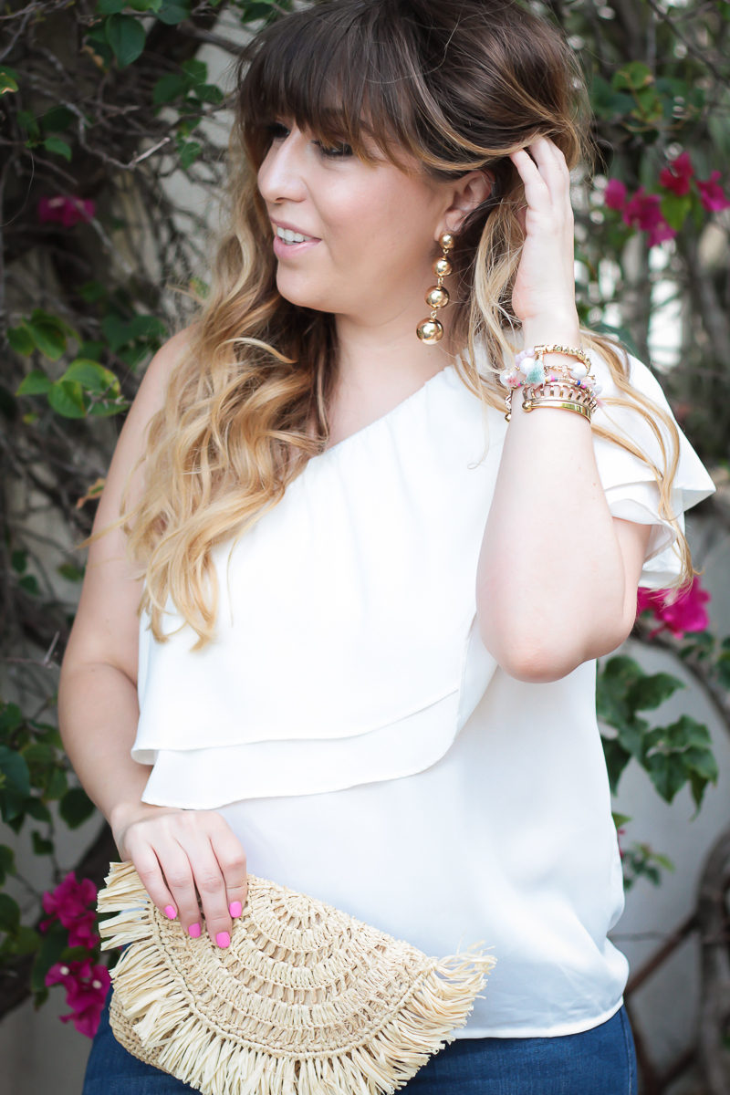  Miami fashion blogger Stephanie Pernas wearing Baublebar Mya Drops earrings and a one shoulder top 