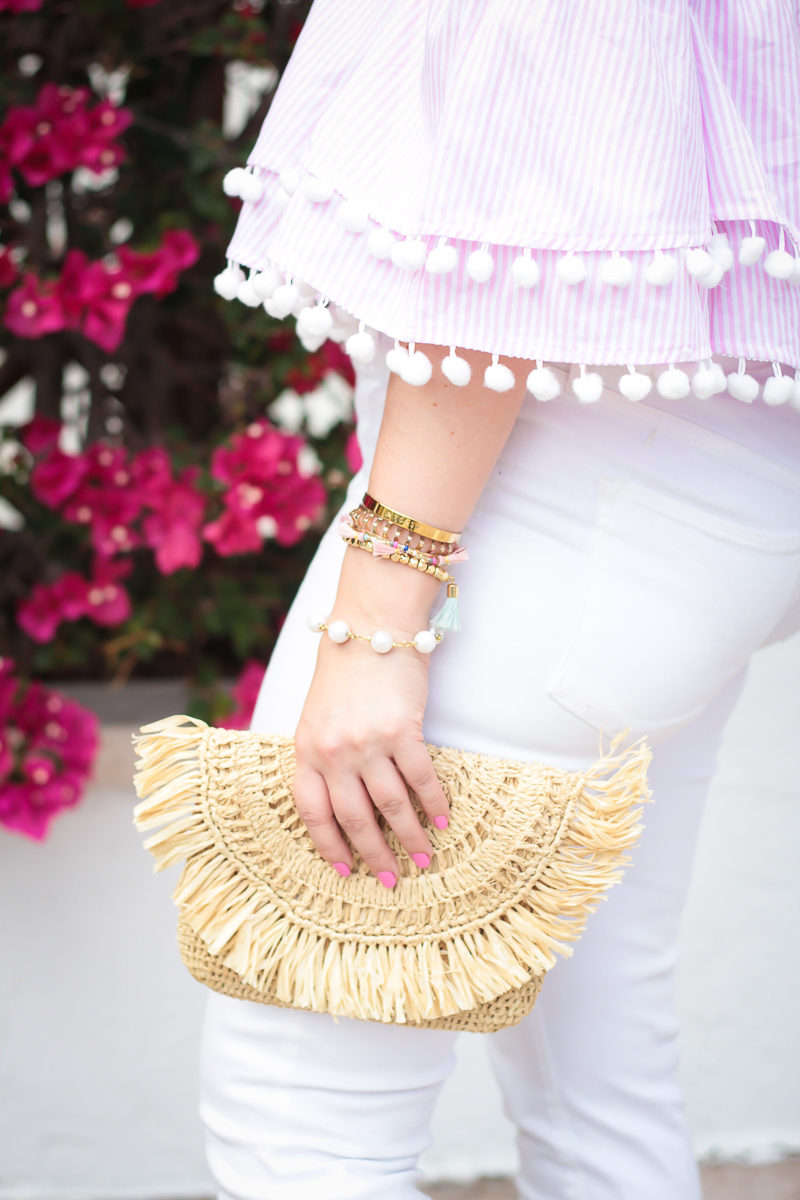 Miami fashion blogger Stephanie Pernas styles a pink pom pom top and Mar y Sol Mia clutch 