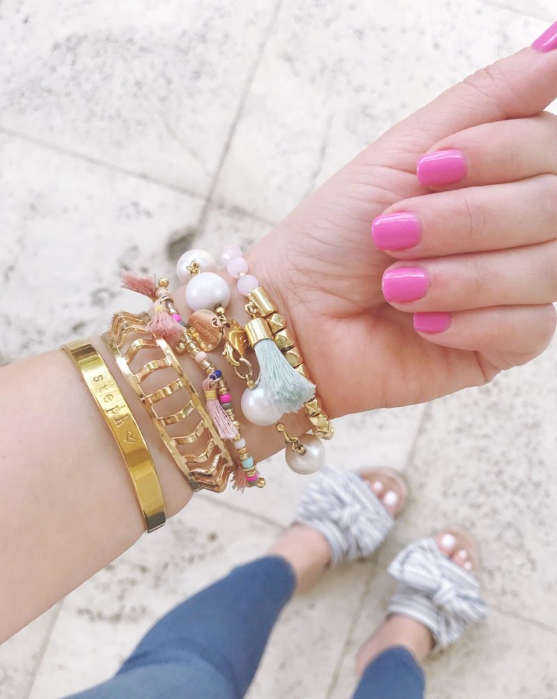 Miami fashion blogger Stephanie Pernas shares a photo of her pink manicure and bracelet arm party