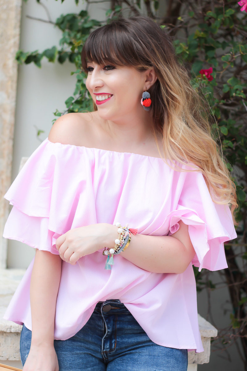 Miami fashion blogger Stephanie Pernas wearing an off the shoulder top and Baublebar pom pom hoop earrings 