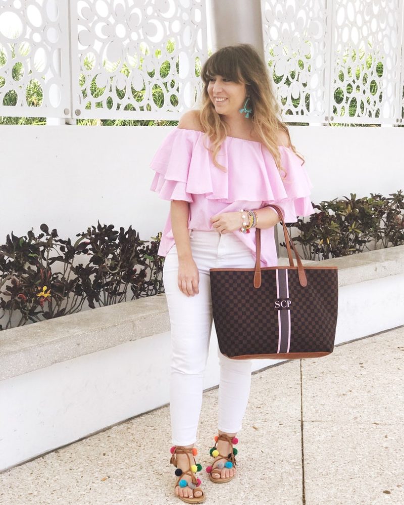 Miami fashion blogger Stephanie Pernas wearing a pink off the shoulder top and white jeans