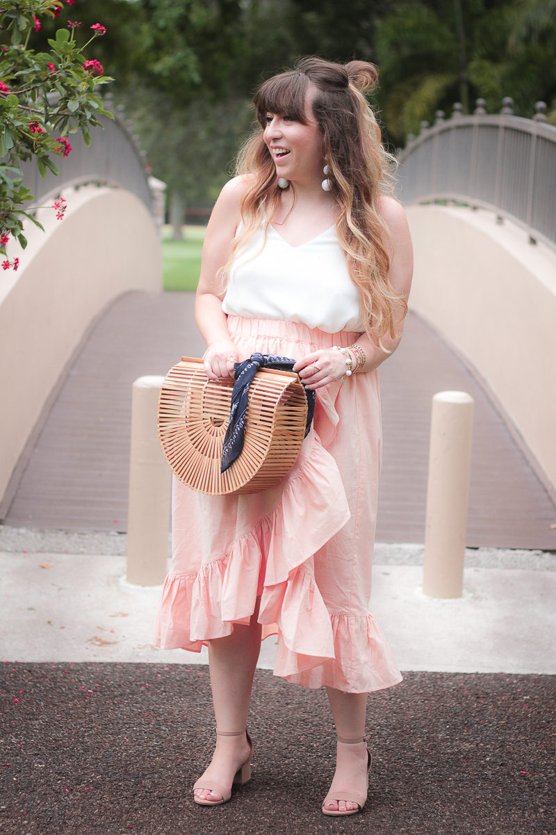 Miami fashion blogger Stephanie Pernas wearing an ASOS pink ruffle midi skirt 