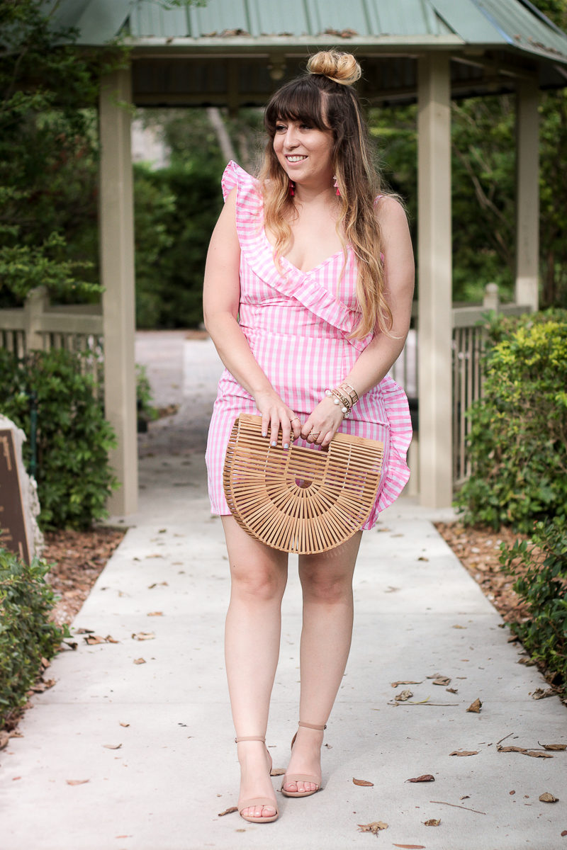 Miami fashion blogger Stephanie Pernas wearing a pink gingham dress 