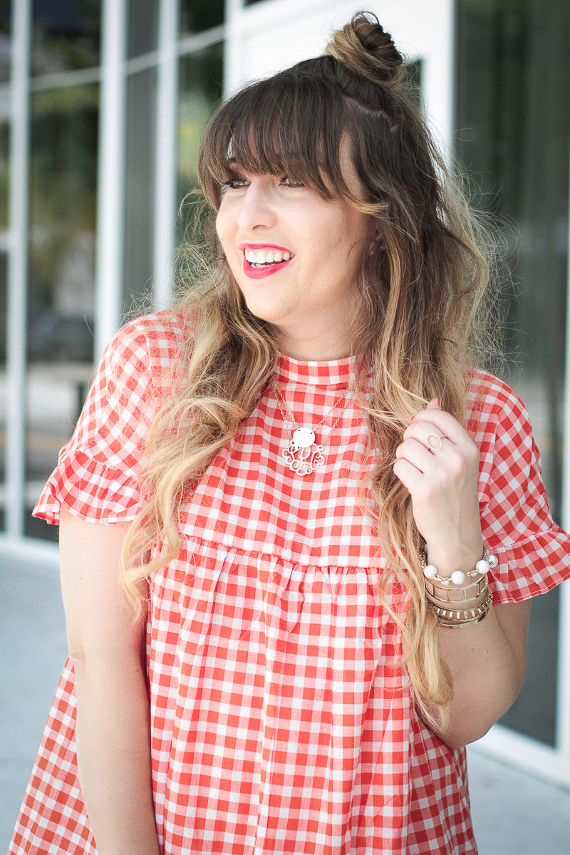  Miami fashion blogger Stephanie Pernas wearing a ruffle gingham dress for summer