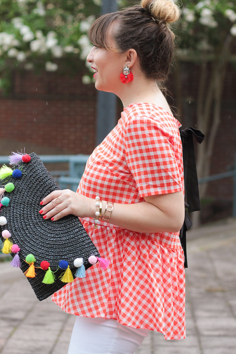 Red gingham top and pom pom clutch