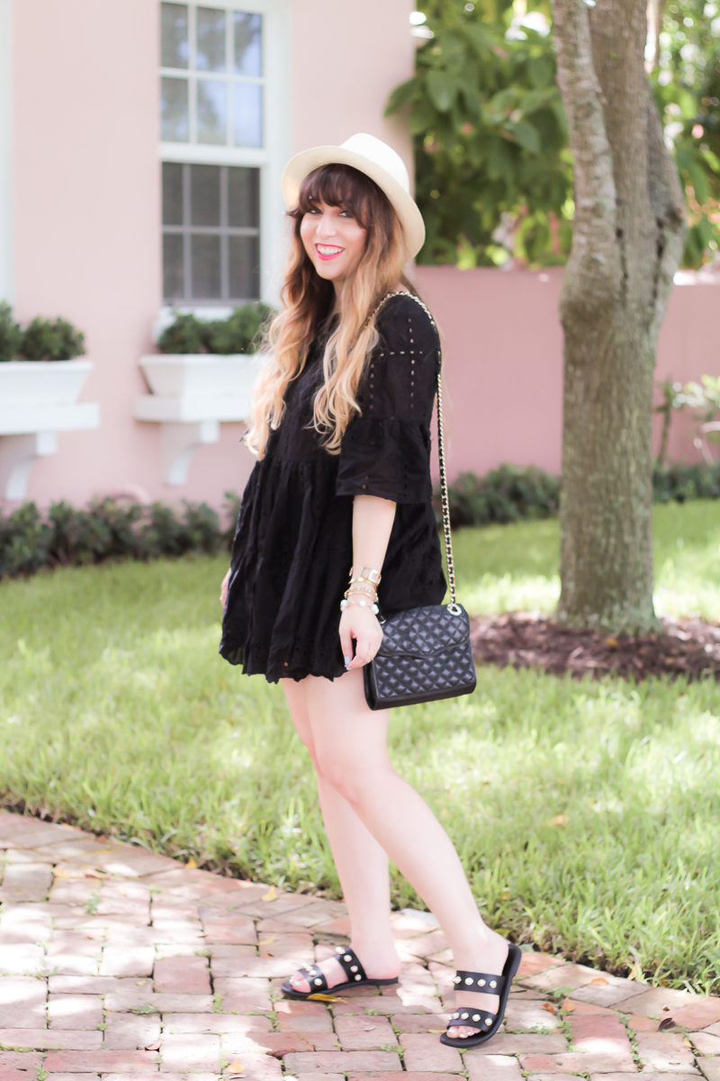 Fashion blogger Stephanie Pernas wearing a cute black dress and sandals for a casual summer outfit idea